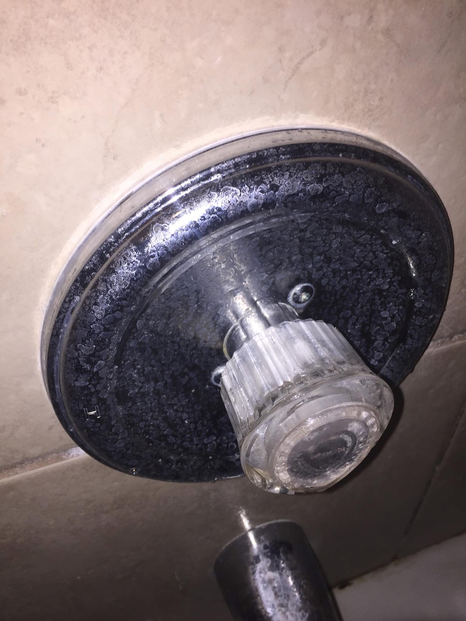 Shower fixture before cleaning